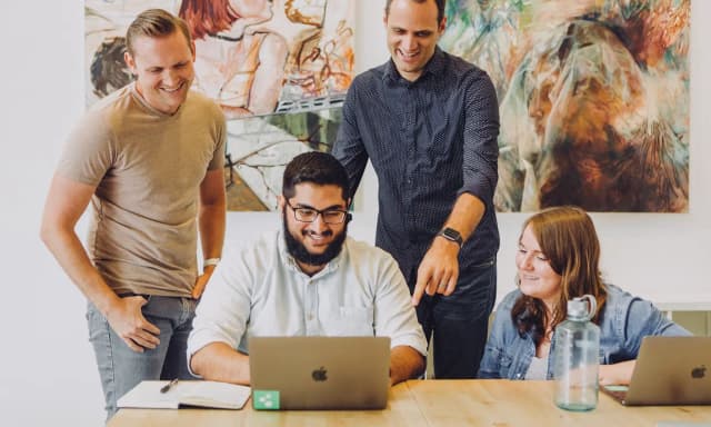 Image of a group of people working together in a company.
